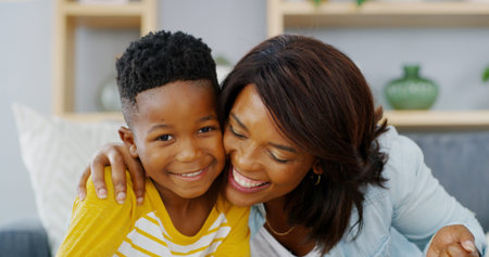 Smile, mother and hug child in home for love, care and family bonding together. African kid, mom and...