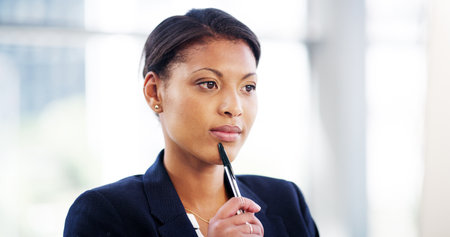 African woman, lawyer and thinking in office with pen for investigation, lead or link info for court case. Person, advocate or attorney with insight, perspective or decision for job at law firmの写真素材