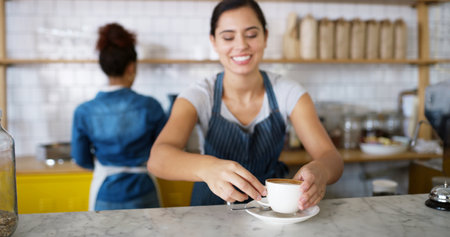 Smile, woman and serving coffee at cafe of customer service, espresso drink and order collection. Female waiter, client and giving beverage of breakfast catering, server help and hospitality industryの写真素材
