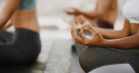 Lotus pose, meditation and hands of woman in nature for peace, workout and spiritual retreat. Zen, healing and calm with closeup of people and outdoor yoga class for chakra, mindfulness and healthの写真素材