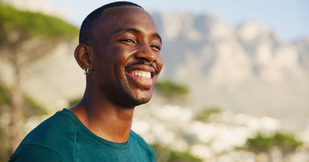 Happy, fitness and black man with thinking outdoor for marathon break, mountain view and relax with scenery. Space, runner and person with smile for cardio exercise, workout performance and trainingの写真素材