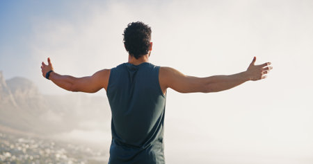 Freedom, runner and back of man in nature for mockup space, thinking or health. Fitness, workout and reflection with person or training with mountain view for sports athlete, achievement and exerciseの写真素材