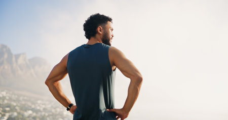 Relax, fitness and back of man in nature for mockup space, thinking and health. Runner, workout and reflection with person and training with mountain view for sports athlete, marathon and exerciseの写真素材