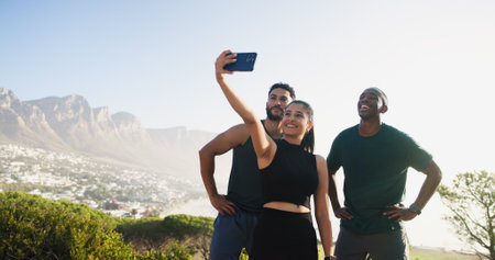 Happy people, fitness and nature with selfie for workout memory, exercise or outdoor training together. Active, group or friends with smile for photography, picture or health and wellness on mountainの写真素材