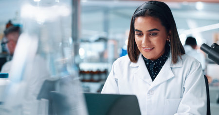 Laptop, science and woman in laboratory for medical research, healthcare innovation and test. Happy scientist, chemist and computer for biotechnology, experiment report and microbiology developmentの写真素材