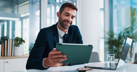 Man, tablet and happy with laptop in office with stats, review and research with fintech...