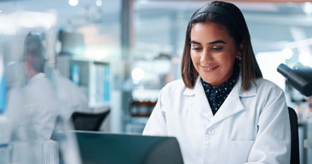 Research, science and woman in lab, laptop and internet with medical analysis, email and test results. Person, innovation or researcher with tech, cure and digital app with online reading or solutionの写真素材