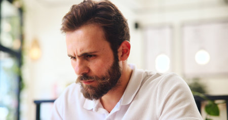 Thinking, business and man in office, stress and overwhelmed with contemplation. Person, copywriting and employee in workplace, thoughtful and professional with deadline, frustrated and burnoutの写真素材