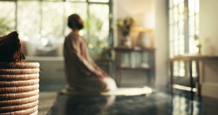 Muslim, prayer and faith with man in home for gratitude, ramadan kareem and worship. Spiritual, peace and Islamic with person and dua in living room of apartment for eid Mubarak, Allah and religionの写真素材
