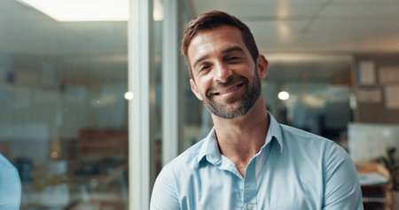 Businessman, portrait and office with smile, pride and confidence for bookkeeping as accountant. Male person, night and excited in finance agency, banking or investment opportunity for payroll jobの写真素材