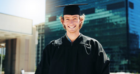 City, portrait and student with of graduate man outdoor for celebration or education event. Future, scholarship and smile with happy college or university in urban town for graduation or milestoneの写真素材