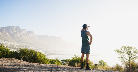 View, runner and back of man in nature and relax for mockup space, thinking and health. Fitness, workout and reflection with person and training with mountain for sports athlete, scenery or exerciseの写真素材