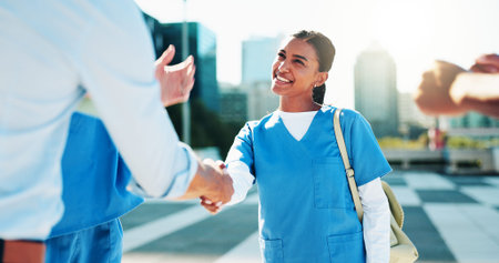 Medical students, happy people and handshake for support, agreement or residency completion....