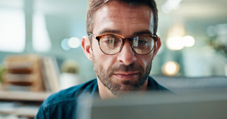 Office, businessman and journalist with laptop for information, research and news for publication. Career, male person and content writer with glasses for proofreading, editing story and digital blogの写真素材