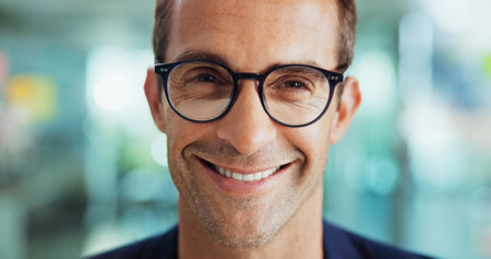 Creative, professional and portrait of businessman with glasses for editing, publishing and journalism career. Office, media agency and face of person with pride, confidence and happy for writer jobの写真素材