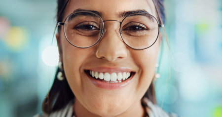 Creative, happy and portrait of business woman with glasses for pride, confidence and professional career. Office, media agency and closeup of person with frames for eyesight, vision and optometryの写真素材