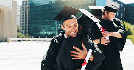 City, graduation and hugging with student friends outdoor for celebration or education event. Certificate, embracing and future with happy college or university graduate people downtown for milestoneの写真素材