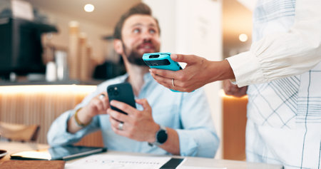 Freelance man, customer and waiter with pos machine at coffee shop for payment, NFC transaction or wireless atm. Business person, purchase and phone with credit card for fintech, tap or cafe checkoutの写真素材