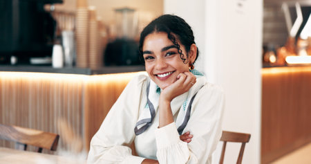 Happy, remote work and portrait of businesswoman in cafe with confidence for creative career. Journalism, restaurant and female copywriter with pride and smile for freelance job in coffee shop.の写真素材