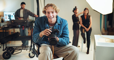 Camera, portrait and smile of photographer man in studio for start of professional photoshoot. Backstage, happy or laughing with makeup artist and model getting ready for photography on film setの写真素材