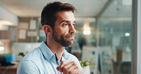 Business, thinking and man in office, stress and problem solving with planning, pressure and review. Deadline, copywriting and journalist with ideas, thoughtful and solution with doubt for proposalの写真素材