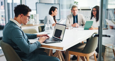 Meeting, businessman and screen with laptop in office, about us and research for stock market. Boardroom, male person and trader with digital for financial performance, risk management and corporateの写真素材
