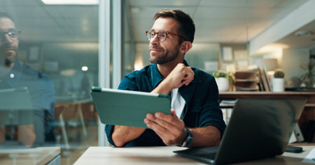 Tablet, thinking and smile with business man in office for planning, ui designer and app review....