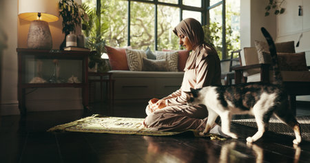 Muslim, prayer and worship with woman at home for gratitude, ramadan kareem and religion. Spiritual, peace and Islamic with person and dua in living room of apartment for eid Mubarak, Allah and faithの写真素材