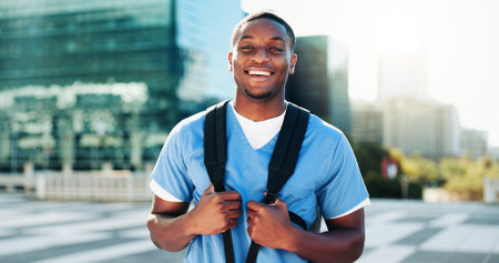 Portrait, black man and medical student in city of healthcare study, about us and education ambition. Male person, backpack and morning commute of nursing internship, academic scholarship and programの写真素材