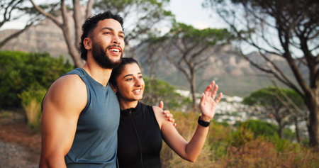 Fitness, hug and thinking with couple outdoor together for cardio, health or sports training. Exercise, love or planning with man and woman embracing in forest for challenge, performance or workoutの写真素材