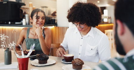 Conversation, breakfast and group of people in cafe for eating, bonding or social gathering. Happy, restaurant and friends enjoying muffin in morning together for talking and connection coffee shop.の写真素材