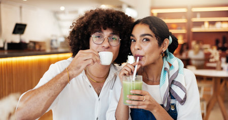 Portrait, love and couple in cafe, date and bonding together with romance, relationship and care. Face, people and man with woman in restaurant, relax and fun with break, green smoothie and espressoの写真素材
