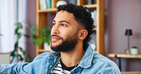 Thinking, man and relax with dream in house for weekend break, planning and ideas for calm morning. Contemplation, male person and resting for reflection, wellness and self care for comfort in loungeの写真素材