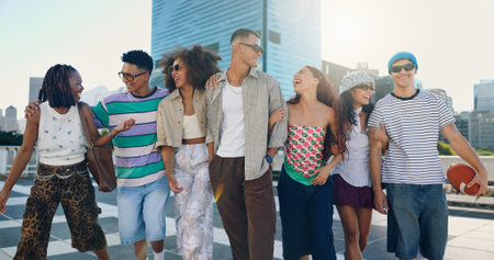 Cool, happy and friends in city with fashion in summer for urban, edgy or trendy style together. Diversity, gen z men and group of creative women in town for street culture, unique clothes or swagの写真素材