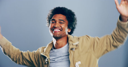 Dance, energy and portrait of happy man on gray background for celebration, clubbing or party fun....