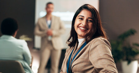Woman, smile and portrait in audience at presentation, hall and learning at corporate conference. Person, happy and training in crowd at employee seminar, confident and career workshop for growthの写真素材
