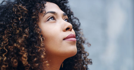 Woman, thinking or looking up with ambition for creative dream, inspiration or wonder on space. Profile, female person or thoughtful remember with perspective, idea or contemplating choice for memoryの写真素材
