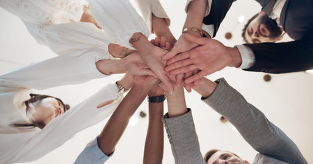Business, people and low angle with hands together in office for corporate celebration,...