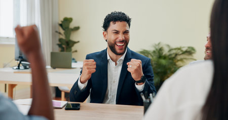 Happy, meeting and success with business man in office for fist pump, discussion and company bonus. Excited, profit report and collaboration with employees in agency for development and winnerの写真素材