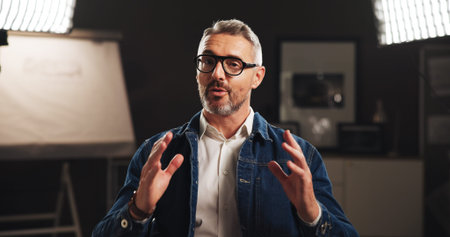 Mature man, portrait and studio interview with talk for architecture, design or development process....