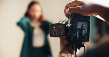 Camera, photography and screen with people in studio together for magazine photoshoot closeup. Backstage, display or production with model and photographer on set for fashion or style catalogの写真素材