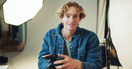 Man, photographer and pride for portrait in studio of photoshoot results, catalog and about us. Smile, person or camera of photography career, film production and magazine editor in creative industryの写真素材
