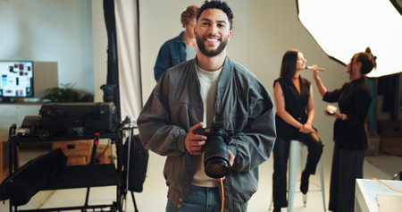 Camera, portrait and smile with photographer in studio for start of catalog or magazine photoshoot. Backstage, creative or media with makeup artist and model getting ready for photography on setの写真素材