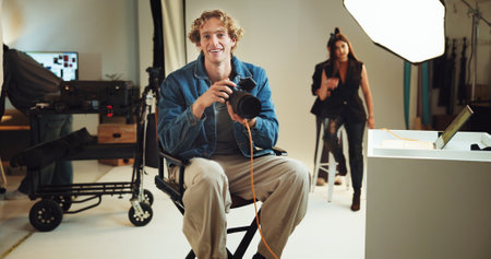 Smile, man and photographer with portrait in studio for photoshoot, catalog cover and selection. People, camera and setup with media of photography, filming production and creative career in industryの写真素材