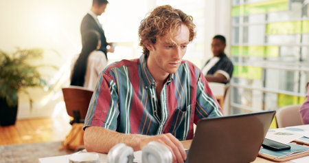 Business, typing and man in office, laptop and internet with connection, creativity agency and...