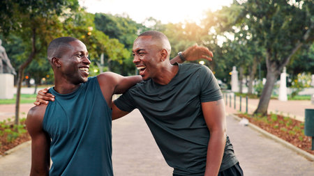 Fitness, friends and men with laugh, hug or hello outdoor for wellness. Smile, greeting and African athlete together for meeting, team training or embrace for reunion at sports park for exerciseの写真素材