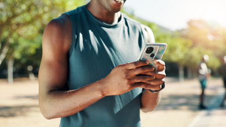 Hands, phone and fitness at park typing for speed stats, challenge and monitor progress in nature. Runner person, smartphone and mobile app for stopwatch, steps and break for workout in summerの写真素材