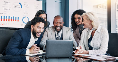 Business people, laptop and meeting with wow for company performance, report or review at office. Excited group, applause and celebration with graph, chart or project statistics for finance successの写真素材
