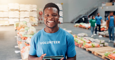 Volunteer, donation and tablet with portrait of man in warehouse for non profit, inventory checklist or helping. Charity, social responsibility and food bank program with person for ngo planの写真素材