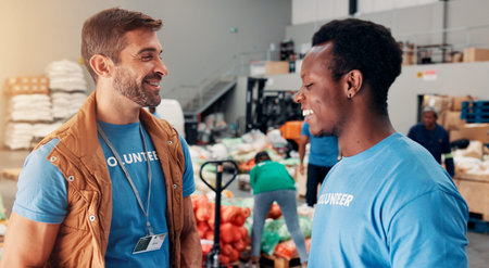 Smile, men and volunteer with food at warehouse of grocery donation, collaboration and charity aid. Happy, people and teamwork of community outreach, social responsibility and non profit distributionの写真素材